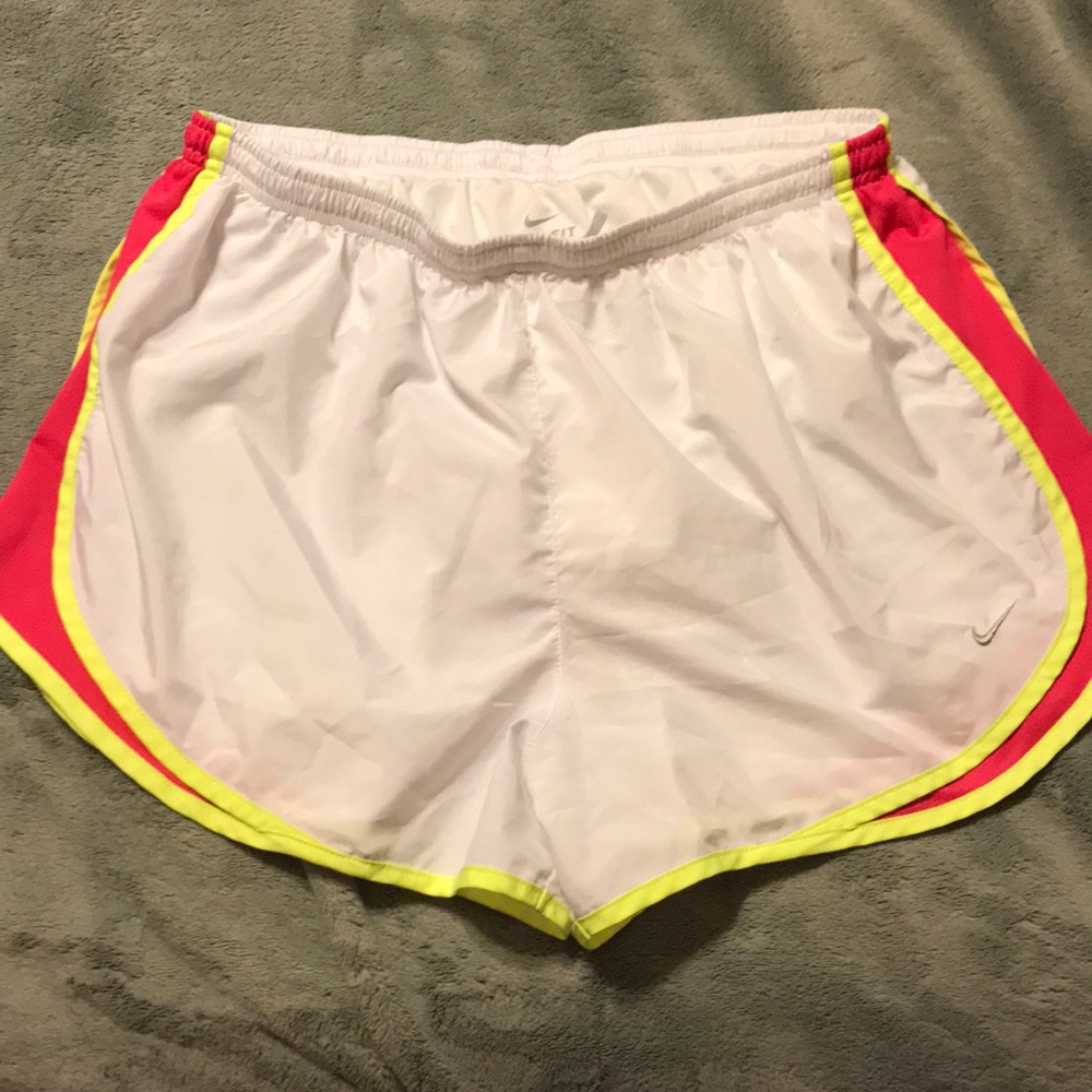 White, pink and yellow Nike shorts